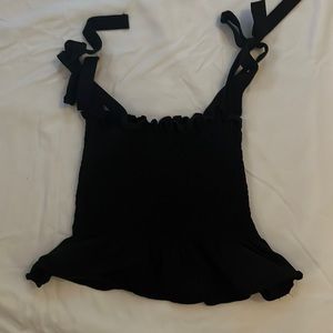 Stretchy mock elastic top with flare bottom. Ties into bows at top